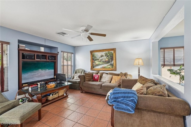 11620 Longhirst Hall Ln, Las Vegas, NV 89138 - living area with light tile patterned flooring and a ceiling fan