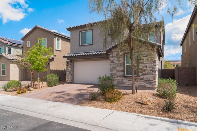 7132 Sayonara Vista St, North Las Vegas, NV 89084 - view of front of house featuring stone siding, stucco siding, a garage, driveway, and a tiled roof