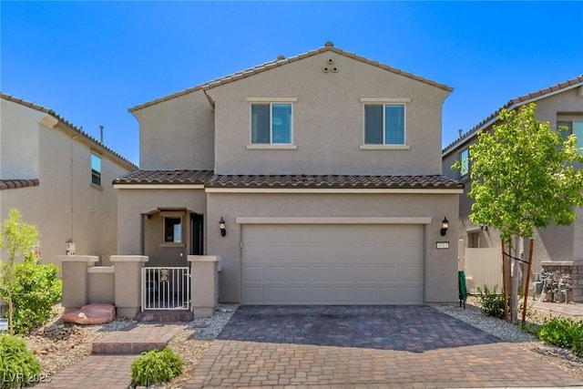 6313 Voss St, North Las Vegas, NV 89081 - mediterranean / spanish-style home with stucco siding, decorative driveway, an attached garage, and a tile roof