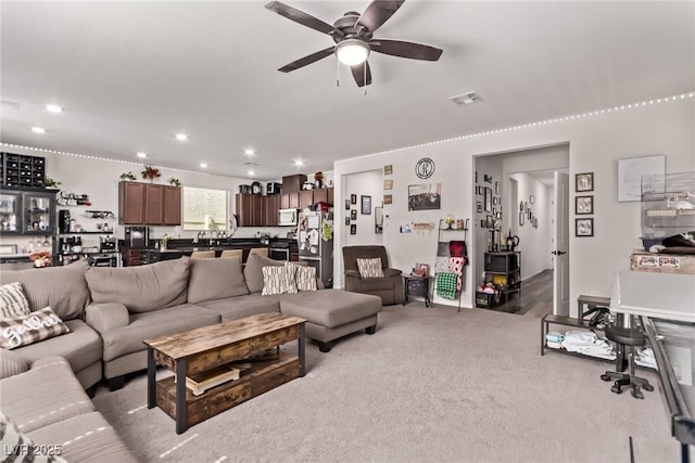 6313 Voss St, North Las Vegas, NV 89081 - living room featuring a ceiling fan, recessed lighting, and carpet