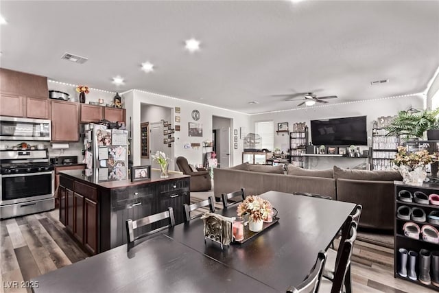 6313 Voss St, North Las Vegas, NV 89081 - dining space featuring ceiling fan and wood finished floors