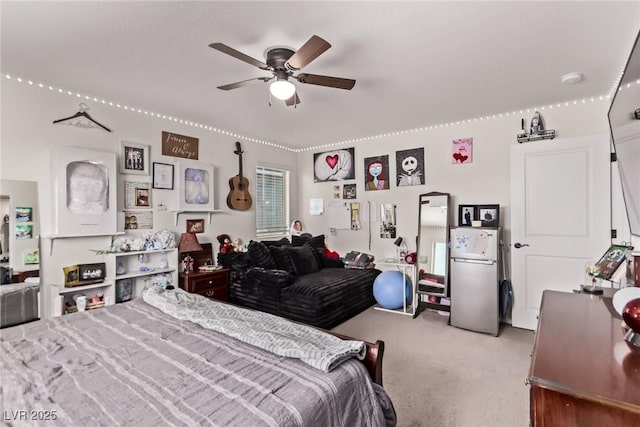 6313 Voss St, North Las Vegas, NV 89081 - bedroom featuring freestanding refrigerator, carpet flooring, and ceiling fan