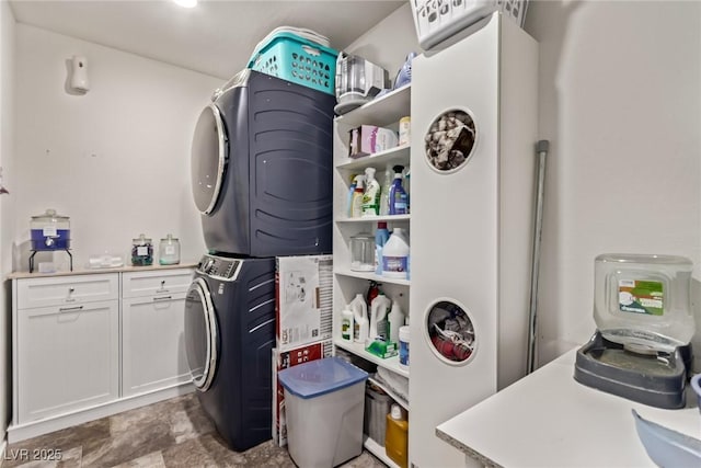 6313 Voss St, North Las Vegas, NV 89081 - laundry room with estacked washer and dryer and cabinet space