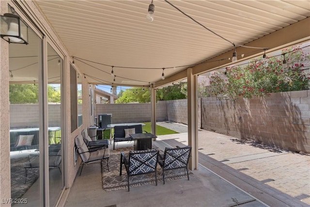 1310 Ripplestone Ave, North Las Vegas, NV 89081 - fenced backyard with a patio area and an outdoor living space