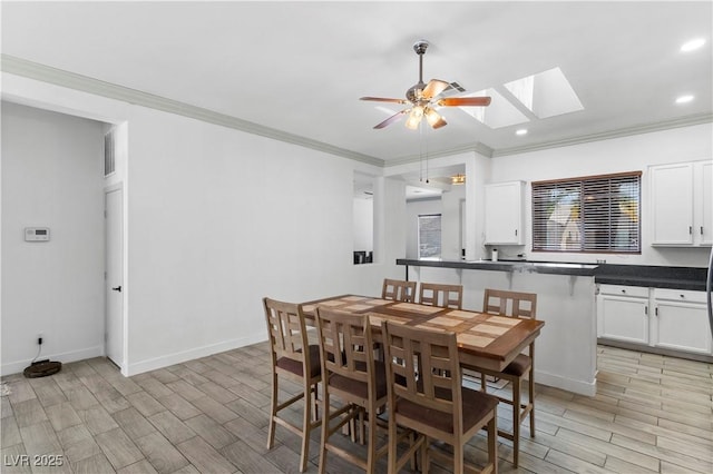 1310 Ripplestone Ave, North Las Vegas, NV 89081 - dining space with a skylight, ceiling fan, wood finish floors, ornamental molding, and recessed lighting