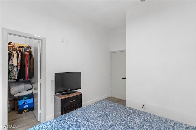1310 Ripplestone Ave, North Las Vegas, NV 89081 - bedroom featuring wood finished floors, a walk in closet, and a closet