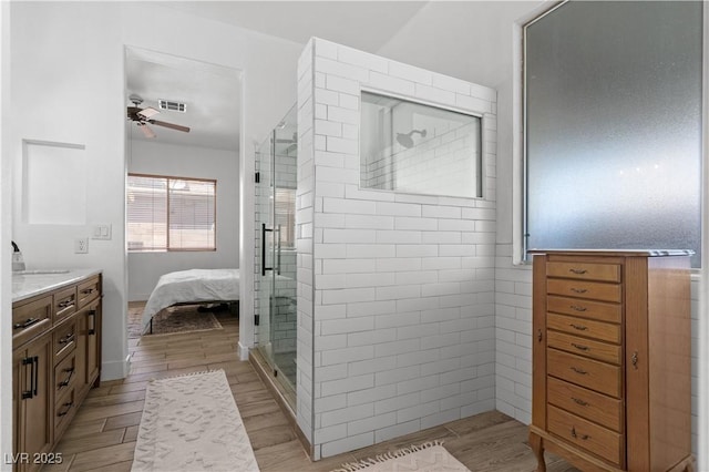 1310 Ripplestone Ave, North Las Vegas, NV 89081 - full bath with ceiling fan, vanity, a shower stall, and wood finished floors