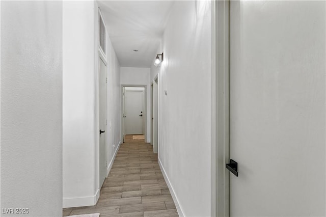1310 Ripplestone Ave, North Las Vegas, NV 89081 - hallway with light wood-style floors and baseboards