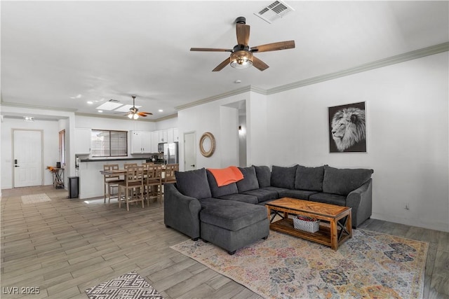 1310 Ripplestone Ave, North Las Vegas, NV 89081 - living room with a ceiling fan, crown molding, light wood-type flooring, and recessed lighting