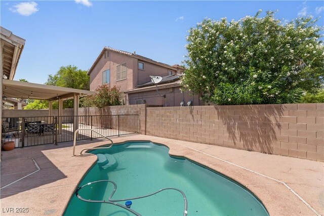 1310 Ripplestone Ave, North Las Vegas, NV 89081 - view of swimming pool with a patio area and a fenced backyard