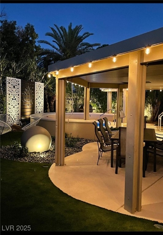 6316 Bluejay Way, Las Vegas, NV 89146 - patio at night featuring a patio area and outdoor dining area
