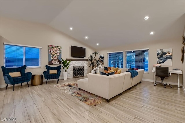 6316 Bluejay Way, Las Vegas, NV 89146 - living room featuring lofted ceiling, recessed lighting, a fireplace, and light wood finished floors
