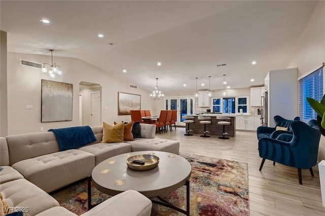 6316 Bluejay Way, Las Vegas, NV 89146 - living area featuring a chandelier, arched walkways, lofted ceiling, light wood-type flooring, and recessed lighting
