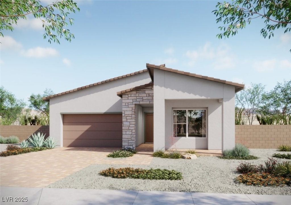 889 Cottonwood Hill Pl, Henderson, NV 89011 - view of front of home with an attached garage, decorative driveway, stucco siding, stone siding, and a tile roof