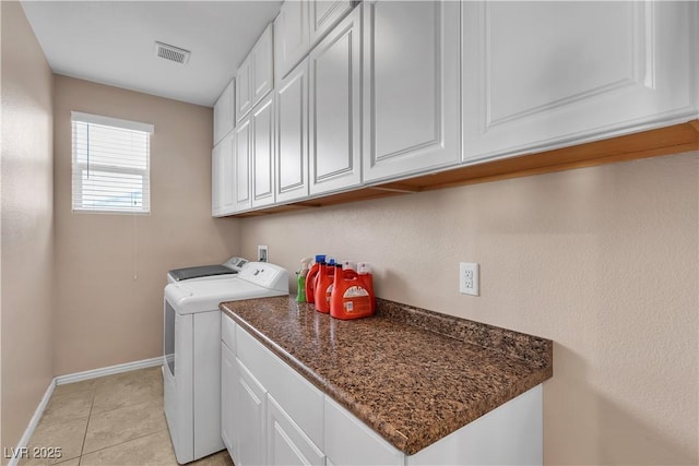 7854 Brianna Cheerful Ave, Las Vegas, NV 89178 - laundry area featuring cabinet space, washing machine and clothes dryer, and light tile patterned flooring
