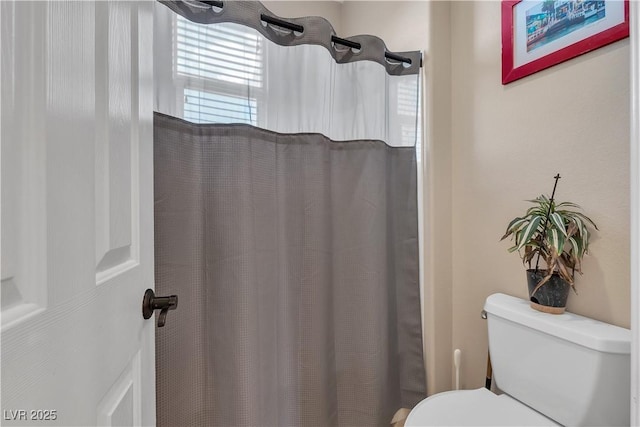 7854 Brianna Cheerful Ave, Las Vegas, NV 89178 - bathroom with toilet and a shower with shower curtain