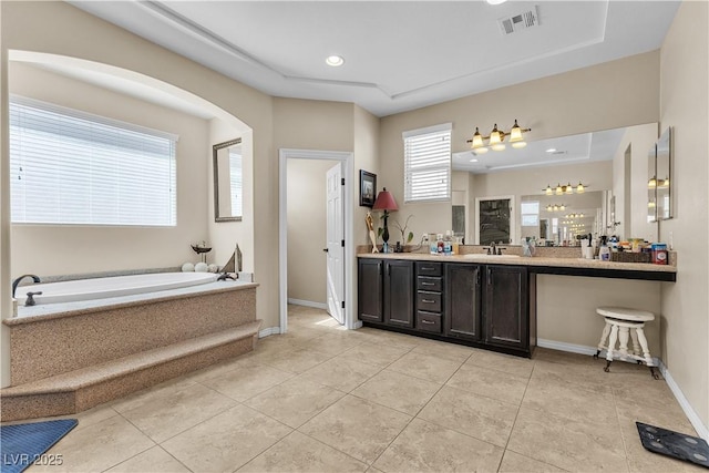 7854 Brianna Cheerful Ave, Las Vegas, NV 89178 - full bath with vanity, a garden tub, tile patterned flooring, a tray ceiling, and recessed lighting