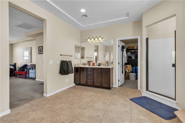 7854 Brianna Cheerful Ave, Las Vegas, NV 89178 - bathroom featuring double vanity, tile patterned flooring, a spacious closet, and a shower stall