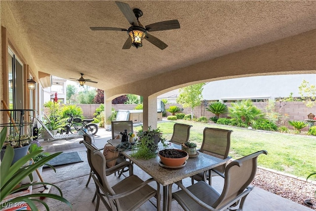 7854 Brianna Cheerful Ave, Las Vegas, NV 89178 - fenced backyard with outdoor dining space, a patio, and ceiling fan