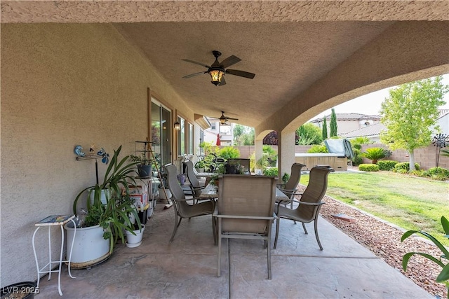 7854 Brianna Cheerful Ave, Las Vegas, NV 89178 - fenced backyard featuring a patio area, ceiling fan, and outdoor dining space