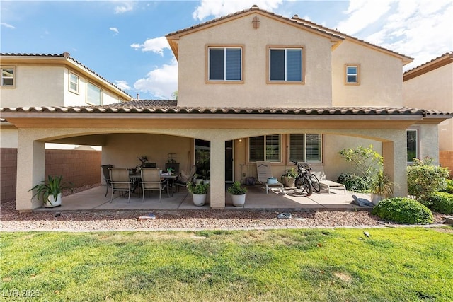 7854 Brianna Cheerful Ave, Las Vegas, NV 89178 - rear view of property featuring a patio, a lawn, and a tiled roof