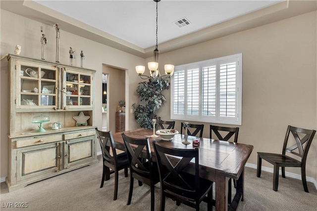 7854 Brianna Cheerful Ave, Las Vegas, NV 89178 - dining area featuring light carpet and a chandelier
