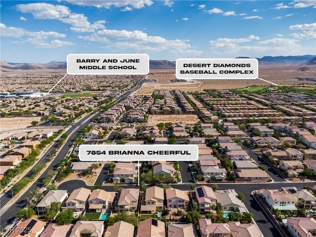 7854 Brianna Cheerful Ave, Las Vegas, NV 89178 - aerial view of residential area with a mountainous background