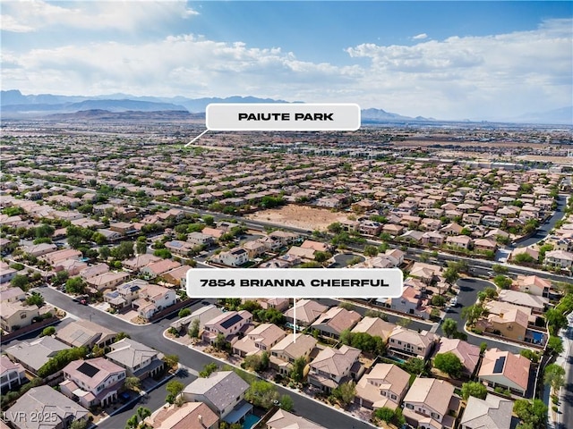 7854 Brianna Cheerful Ave, Las Vegas, NV 89178 - aerial perspective of suburban area featuring a mountainous background
