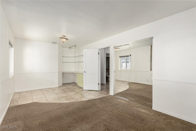 1393 Calmview Pl, Las Vegas, NV 89110 - tiled empty room with carpet floors and baseboards