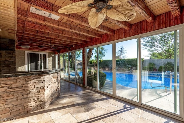 1393 Calmview Pl, Las Vegas, NV 89110 - unfurnished sunroom featuring beamed ceiling