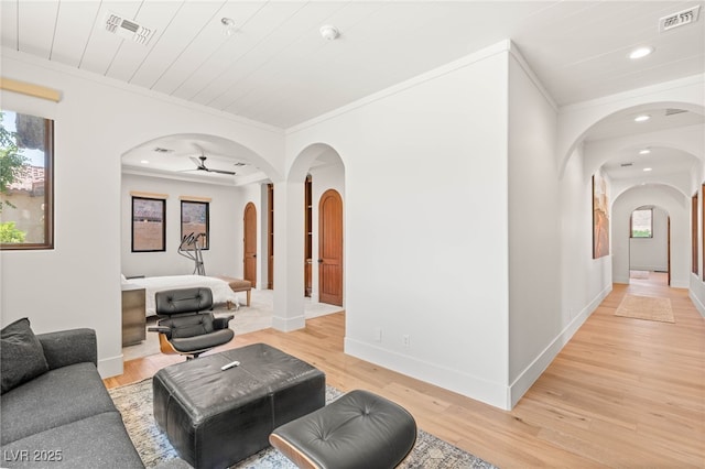 38 Pebble Dunes Ct, Las Vegas, NV 89141 - living area featuring arched walkways, ornamental molding, light wood-type flooring, recessed lighting, and ceiling fan