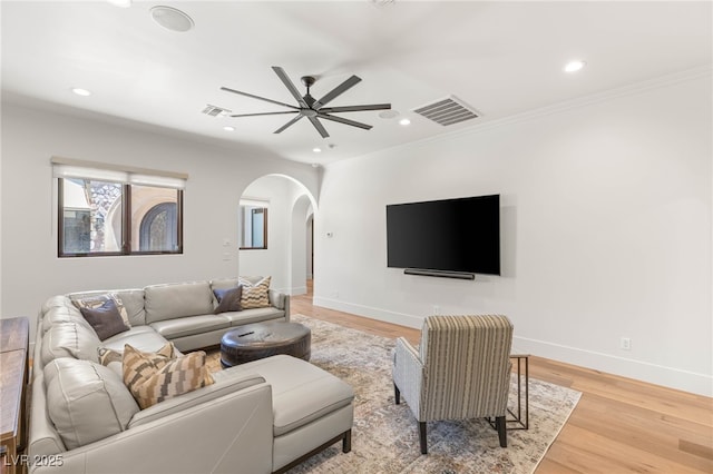 38 Pebble Dunes Ct, Las Vegas, NV 89141 - living area featuring arched walkways, ceiling fan, recessed lighting, light wood-style floors, and ornamental molding