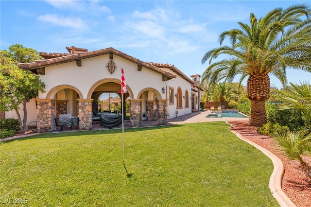 38 Pebble Dunes Ct, Las Vegas, NV 89141 - rear view of house with stucco siding, an outdoor pool, a lawn, and a patio