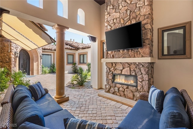 38 Pebble Dunes Ct, Las Vegas, NV 89141 - view of patio / terrace featuring an outdoor stone fireplace
