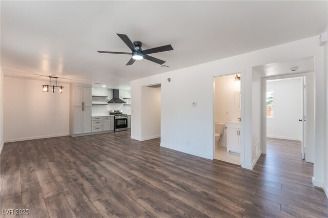 1313 Purple Sage Ave, Las Vegas, NV 89108 - unfurnished living room with dark wood-type flooring and a ceiling fan