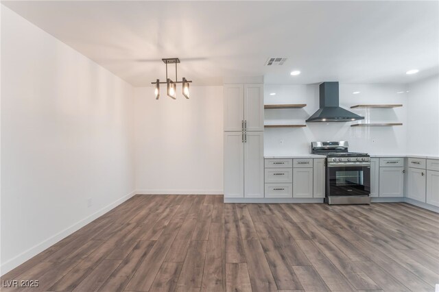 1313 Purple Sage Ave, Las Vegas, NV 89108 - kitchen featuring open shelves, stainless steel gas range, wall chimney range hood, dark wood-style flooring, and recessed lighting