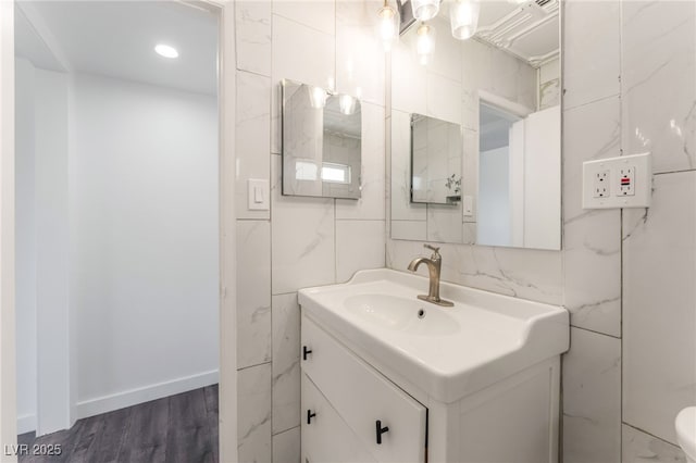 1313 Purple Sage Ave, Las Vegas, NV 89108 - bathroom with vanity, tile walls, and wood finished floors