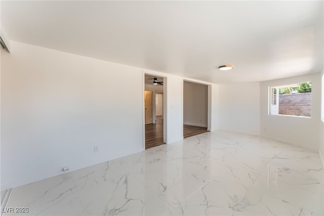 1313 Purple Sage Ave, Las Vegas, NV 89108 - unfurnished room with marble finish flooring and baseboards