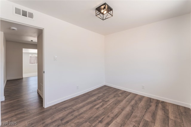 1313 Purple Sage Ave, Las Vegas, NV 89108 - spare room featuring dark wood-type flooring and a smoke detector