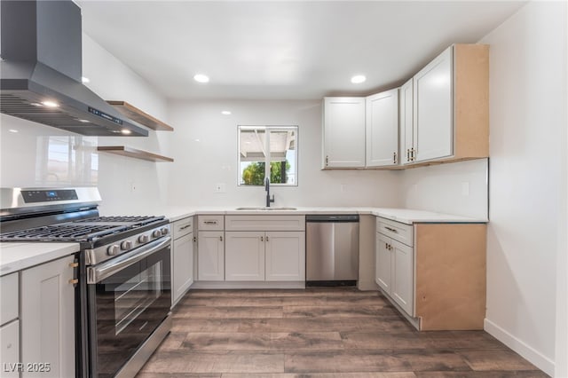 1313 Purple Sage Ave, Las Vegas, NV 89108 - kitchen featuring appliances with stainless steel finishes, wall chimney exhaust hood, open shelves, dark wood-style flooring, and recessed lighting