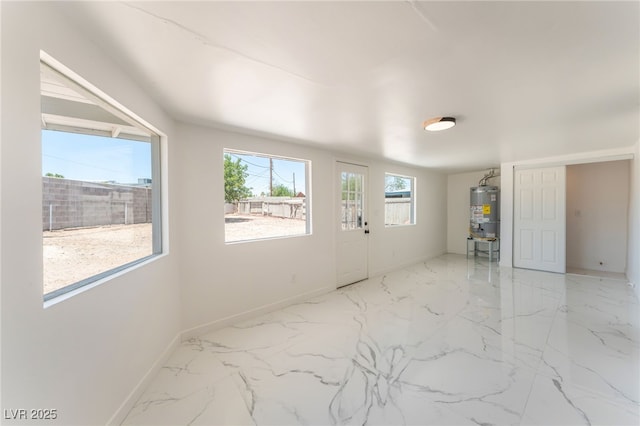 1313 Purple Sage Ave, Las Vegas, NV 89108 - spare room with water heater and marble finish flooring