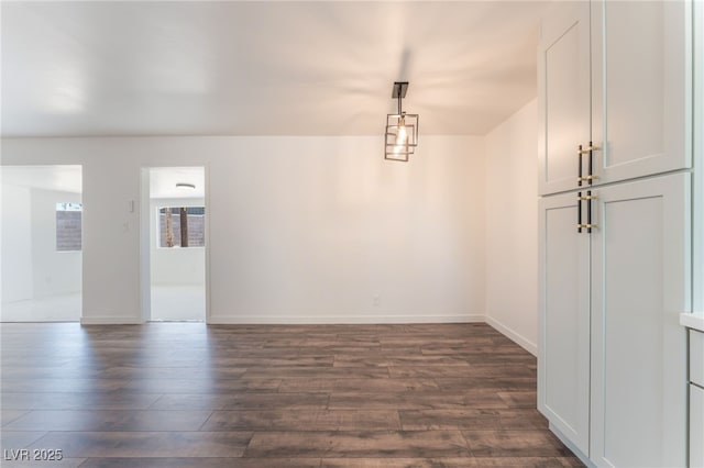 1313 Purple Sage Ave, Las Vegas, NV 89108 - unfurnished dining area featuring dark wood finished floors
