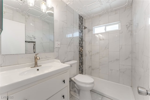 1313 Purple Sage Ave, Las Vegas, NV 89108 - bathroom featuring vanity, tile walls, tiled shower, and marble look tiles