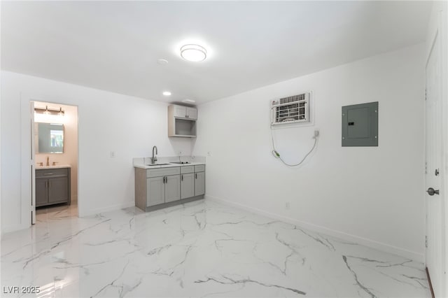1313 Purple Sage Ave, Las Vegas, NV 89108 - interior space featuring electric panel, gray cabinetry, a wall mounted AC, light marble finish floors, and light countertops