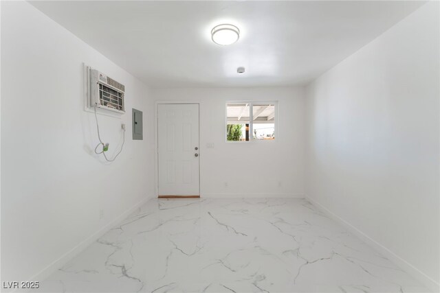 1313 Purple Sage Ave, Las Vegas, NV 89108 - empty room featuring electric panel, light marble finish flooring, and a wall unit AC