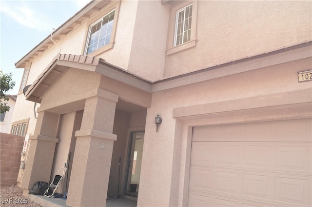 1025 Appaloosa Hills Ave, North Las Vegas, NV 89081 - entrance to property featuring stucco siding and a garage