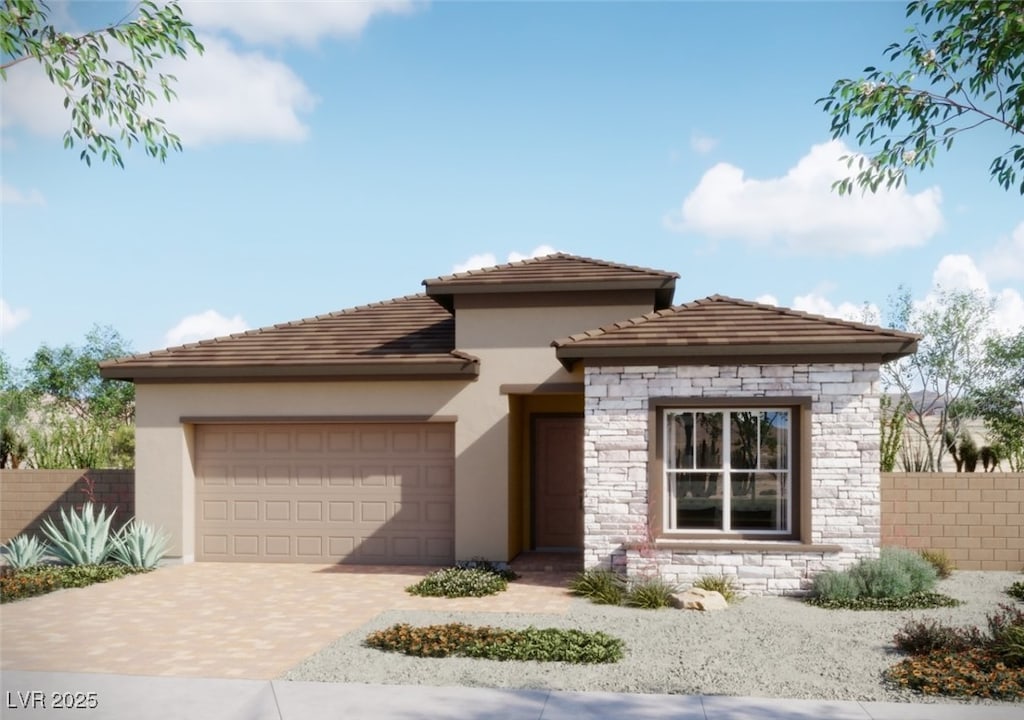 881 Cottonwood Hill Pl, Henderson, NV 89011 - view of front of property featuring stucco siding, an attached garage, stone siding, and decorative driveway