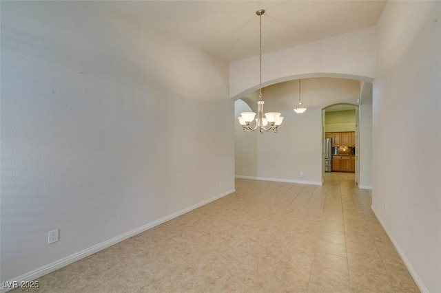 8204 Turbys Treehouse Pl, Las Vegas, NV 89131 - unfurnished room with a chandelier and arched walkways