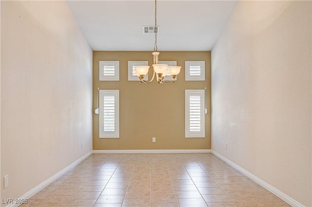 8204 Turbys Treehouse Pl, Las Vegas, NV 89131 - spare room with light tile patterned flooring and a chandelier