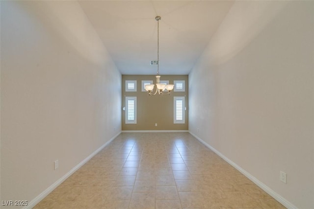 8204 Turbys Treehouse Pl, Las Vegas, NV 89131 - empty room featuring a chandelier and light tile patterned flooring